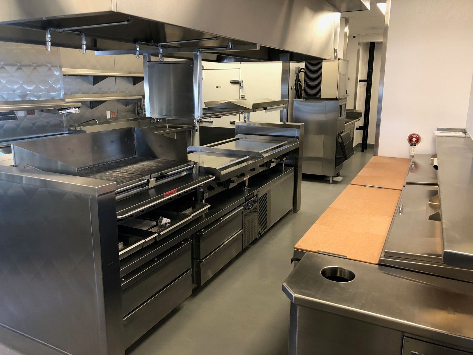 Commercial stainless kitchen line fabricated and installed by Low's Custom Stainless