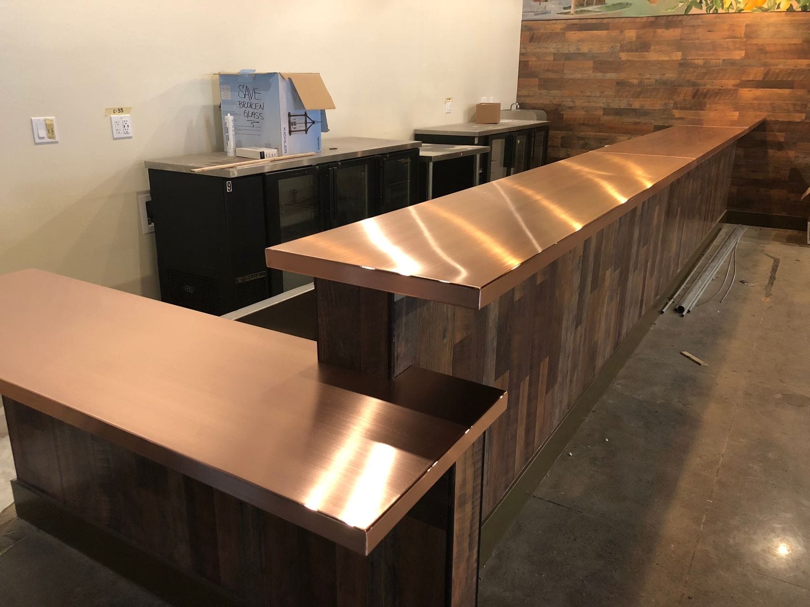 Brushed copper bar tops on reclaimed wood fabricated by Low's Custom Stainless